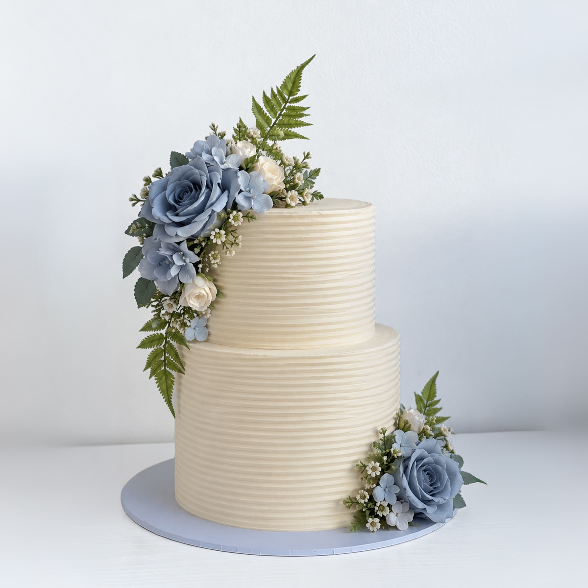 Owner wedding cake reference with separate flowers at the top right and bottom left when viewed from the front